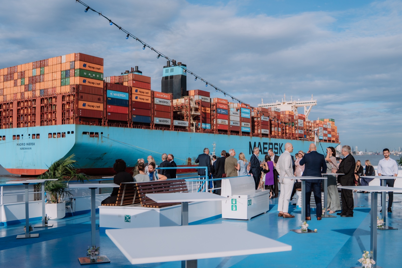 Maersk container ship beside the party boat in the Port of Hamburg